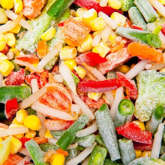 Vibrant bulk candy assortment featuring sour gummy strips, cola bottles, and sanded fruit candies in red, green, yellow, and orange colors for wholesale food distribution.